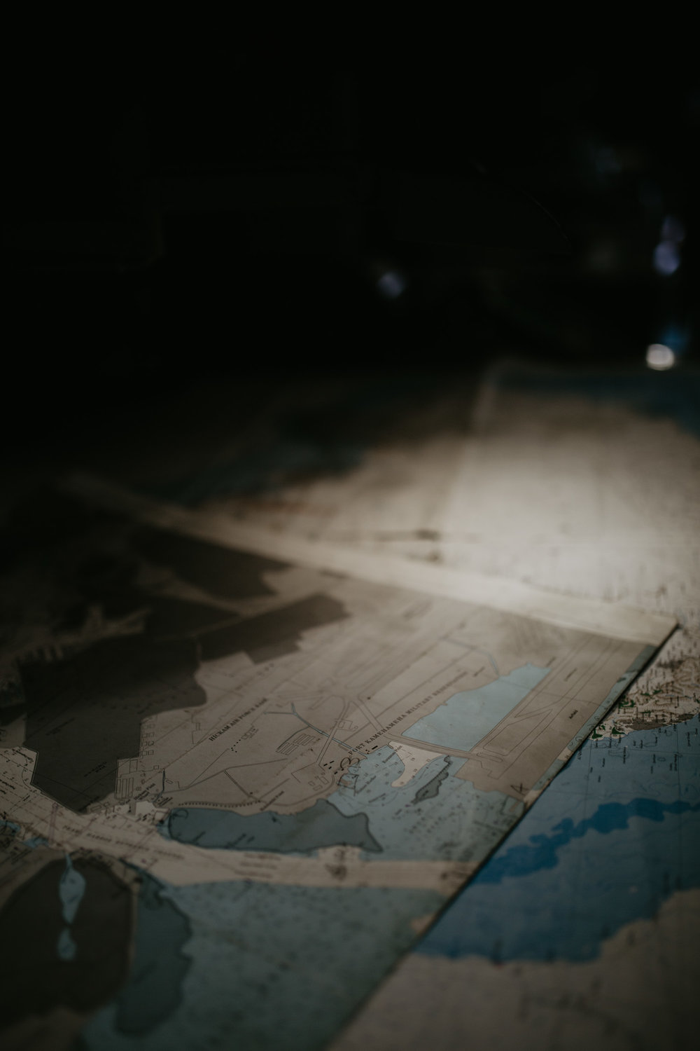  Imagine they are reading through these maps under this dim light… 