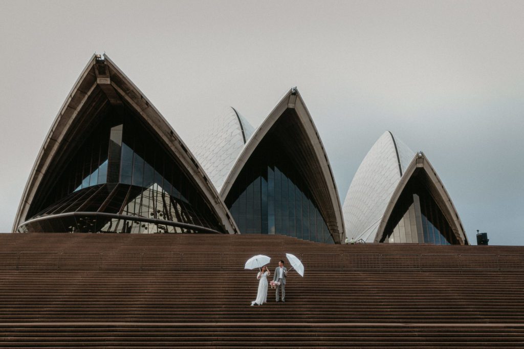 Rainy wedding day photo in front of Sydney Opera House by Akaness Sharks photo